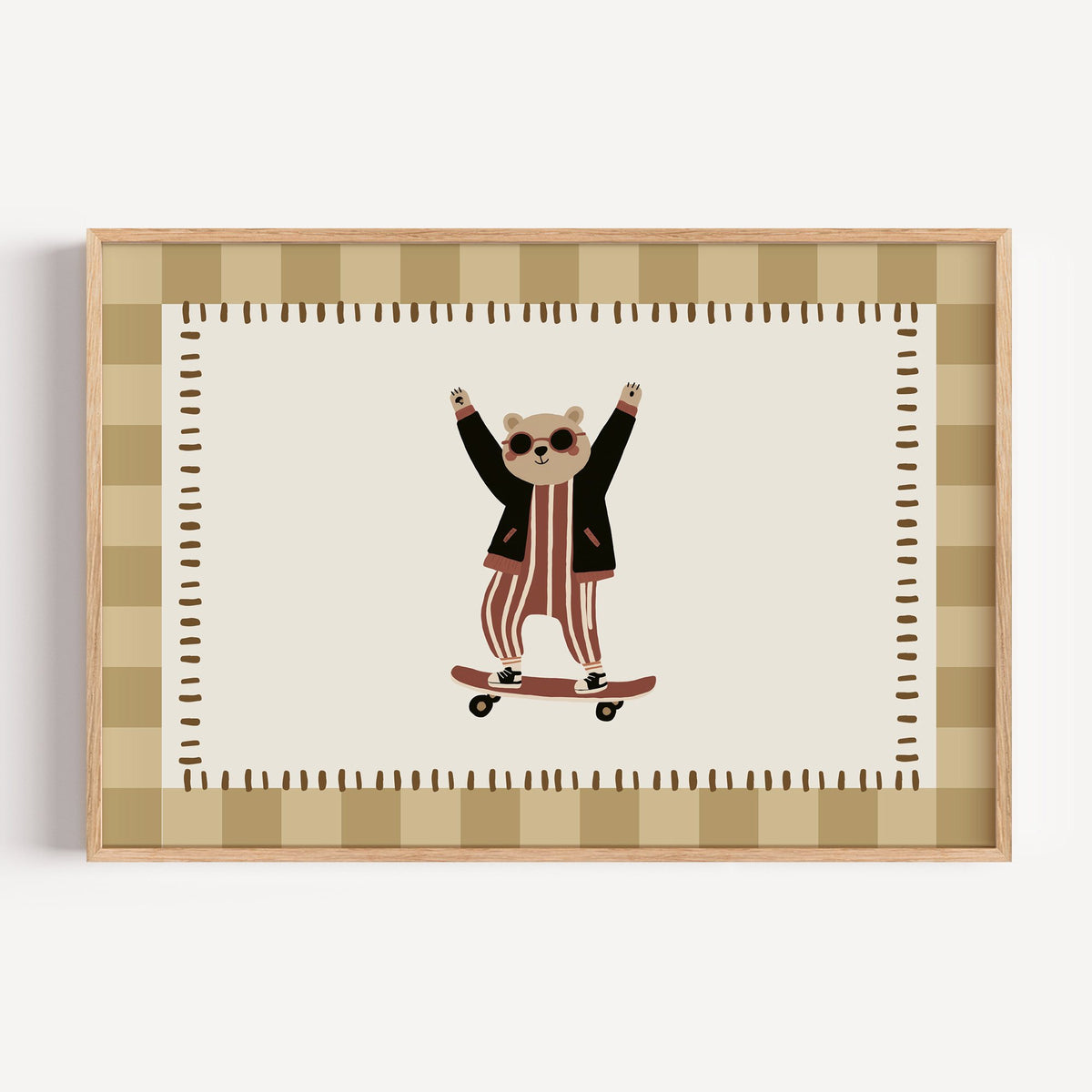 Landscape skateboard bear checker border nursery print in a light oak frame on a plain white wall