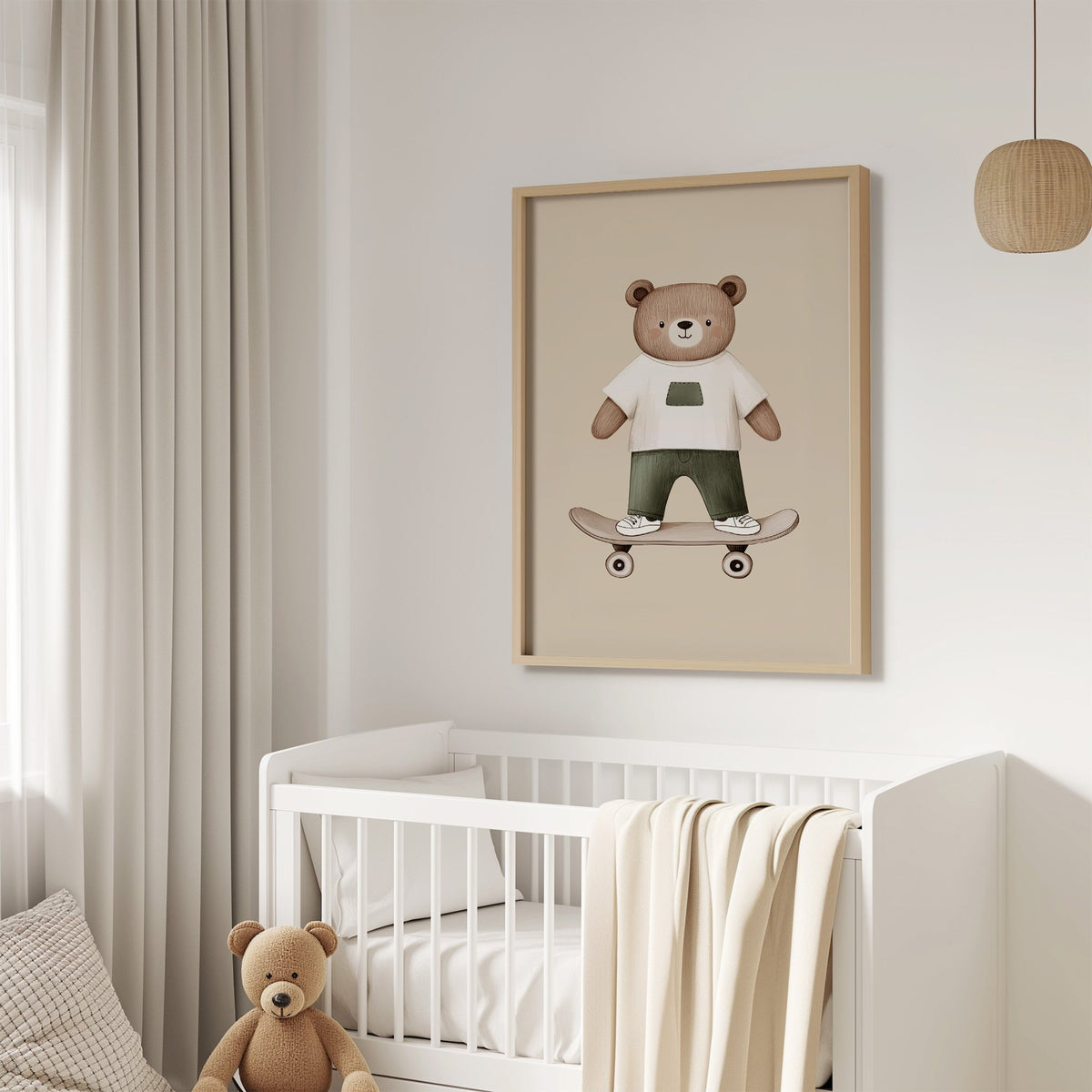 Skateboard bear white tee nursery print in an oak frame above a white crib with a teddy bear