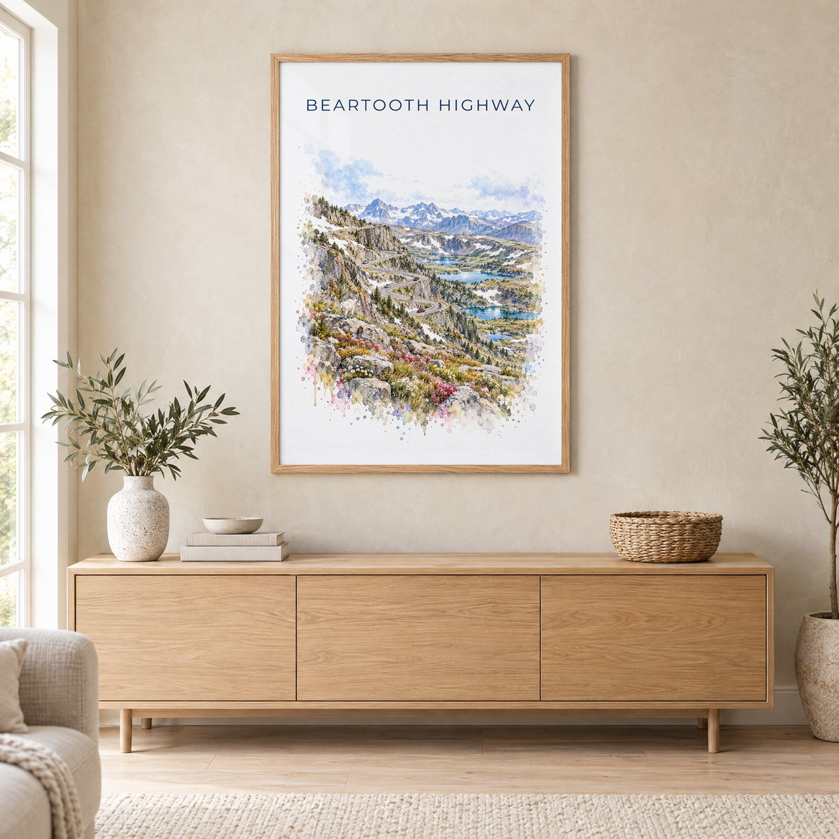 Beartooth Highway watercolor print in an oak frame above a light wood sideboard in a Scandinavian living room