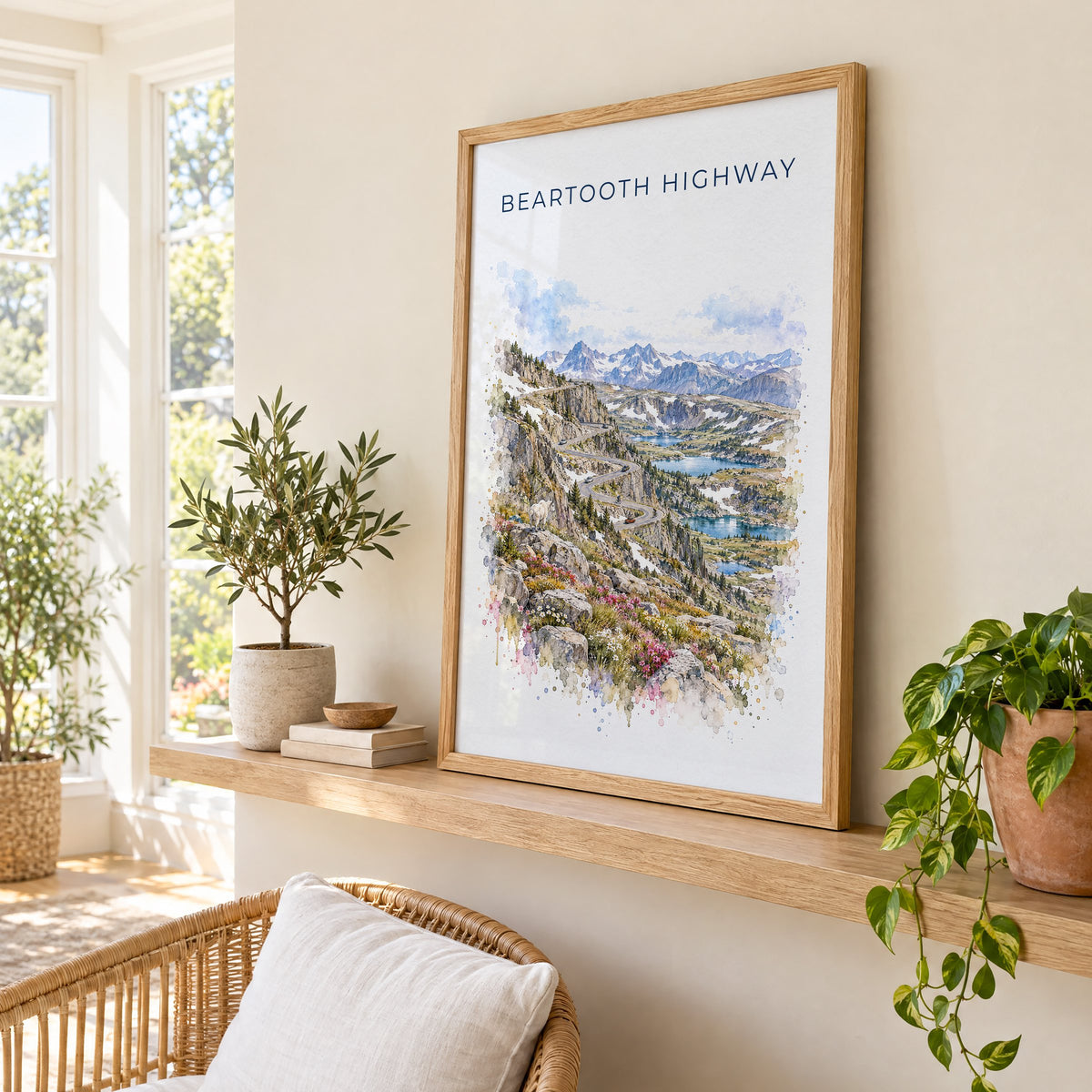 Beartooth Highway watercolor print in an oak frame on a picture ledge in a sunlit sunroom
