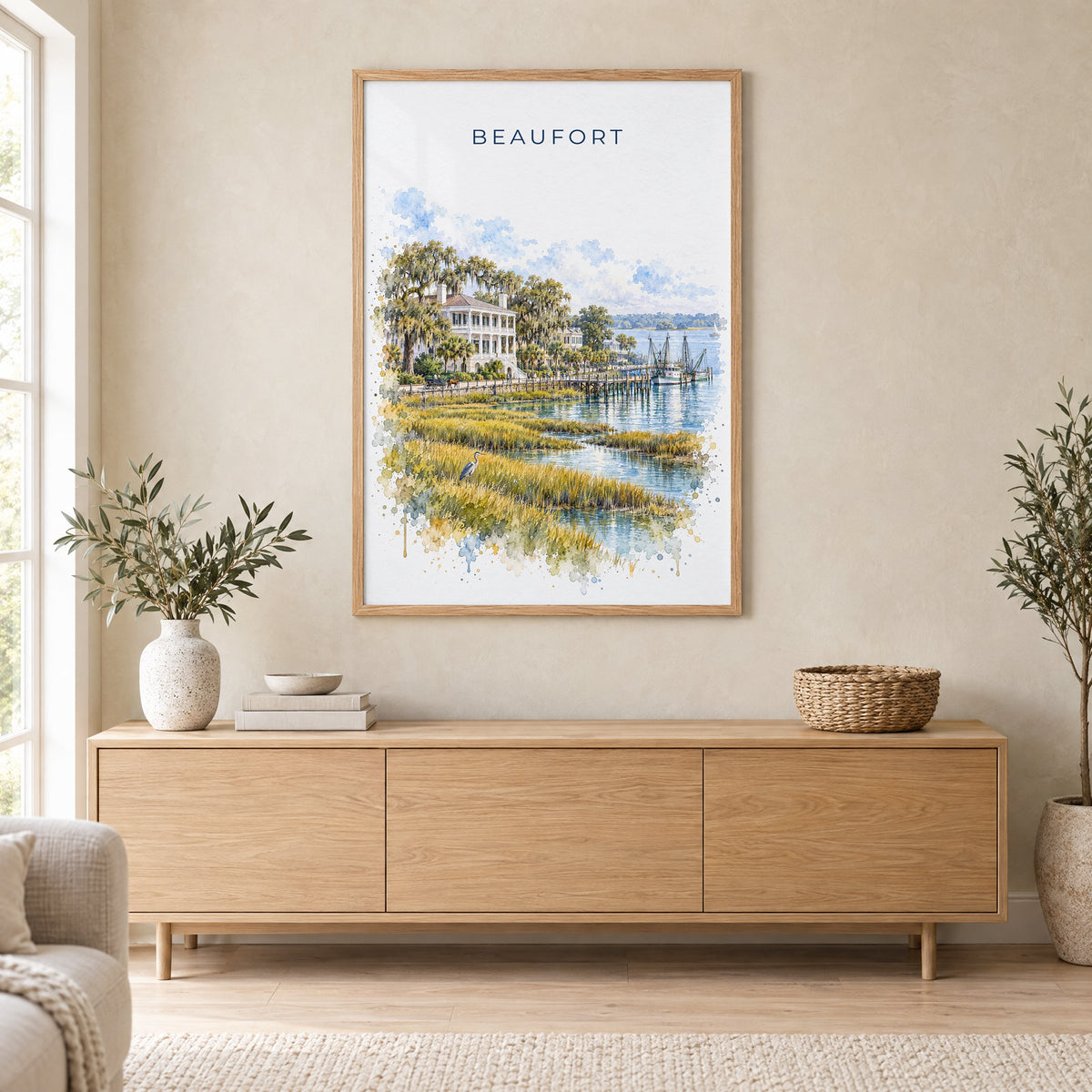 Beaufort, South Carolina watercolor print in an oak frame above a light wood sideboard in a Scandinavian living room