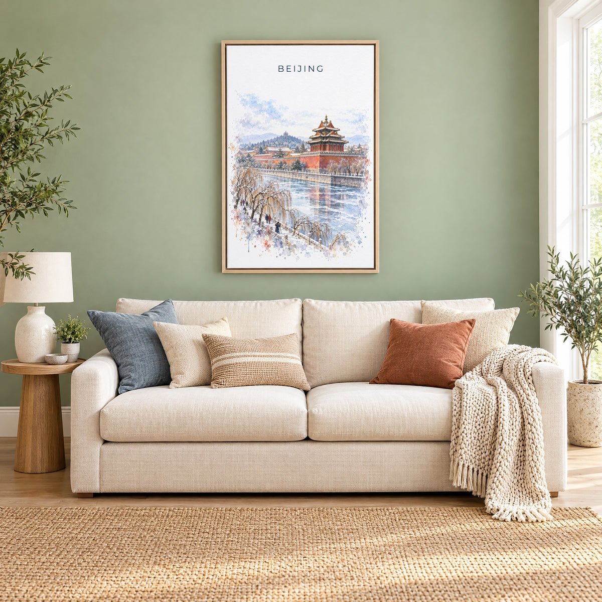 Beijing watercolor print as a natural floater canvas above a cream linen sofa on a sage green wall