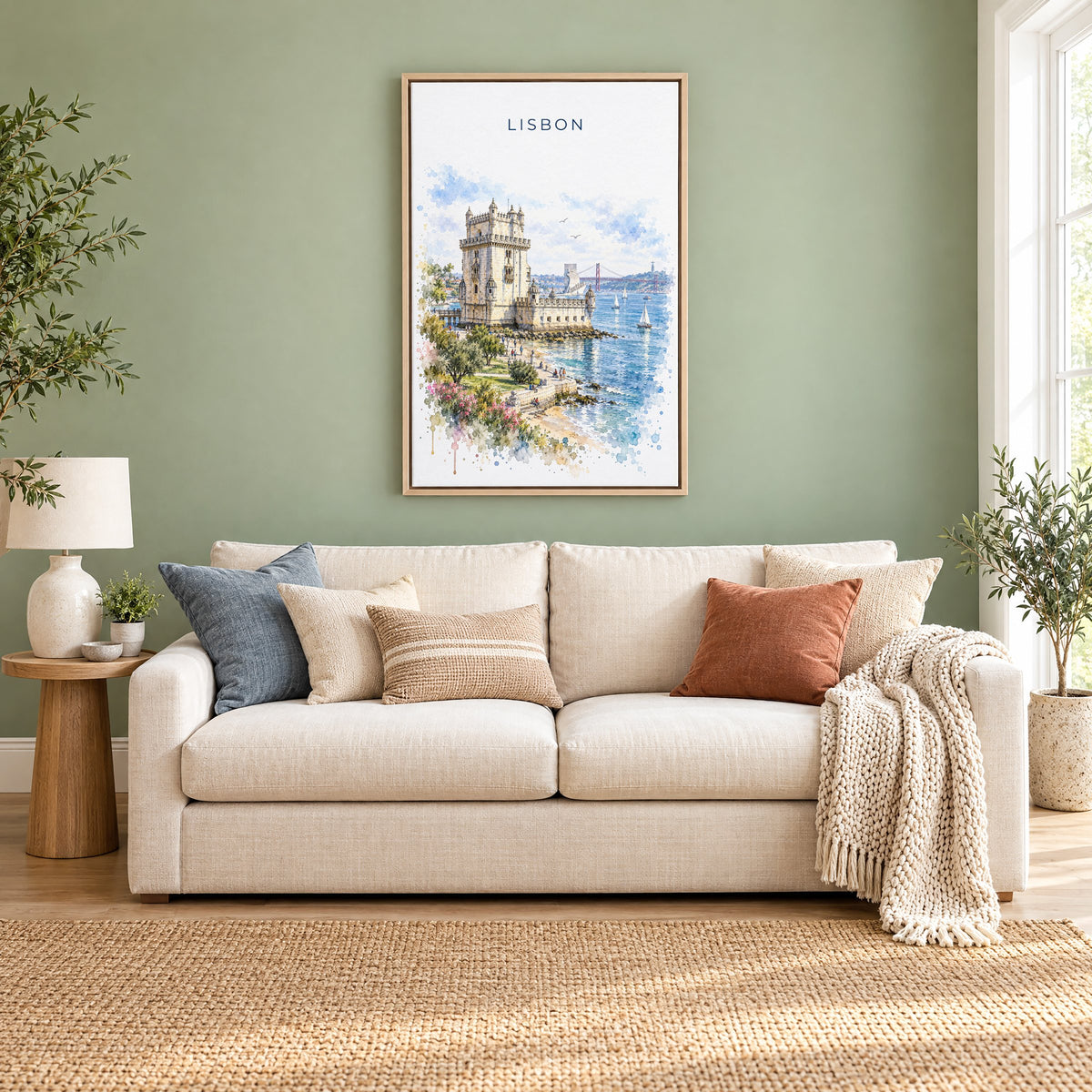 Belém Tower watercolor print as a natural floater canvas above a cream linen sofa on a sage green wall