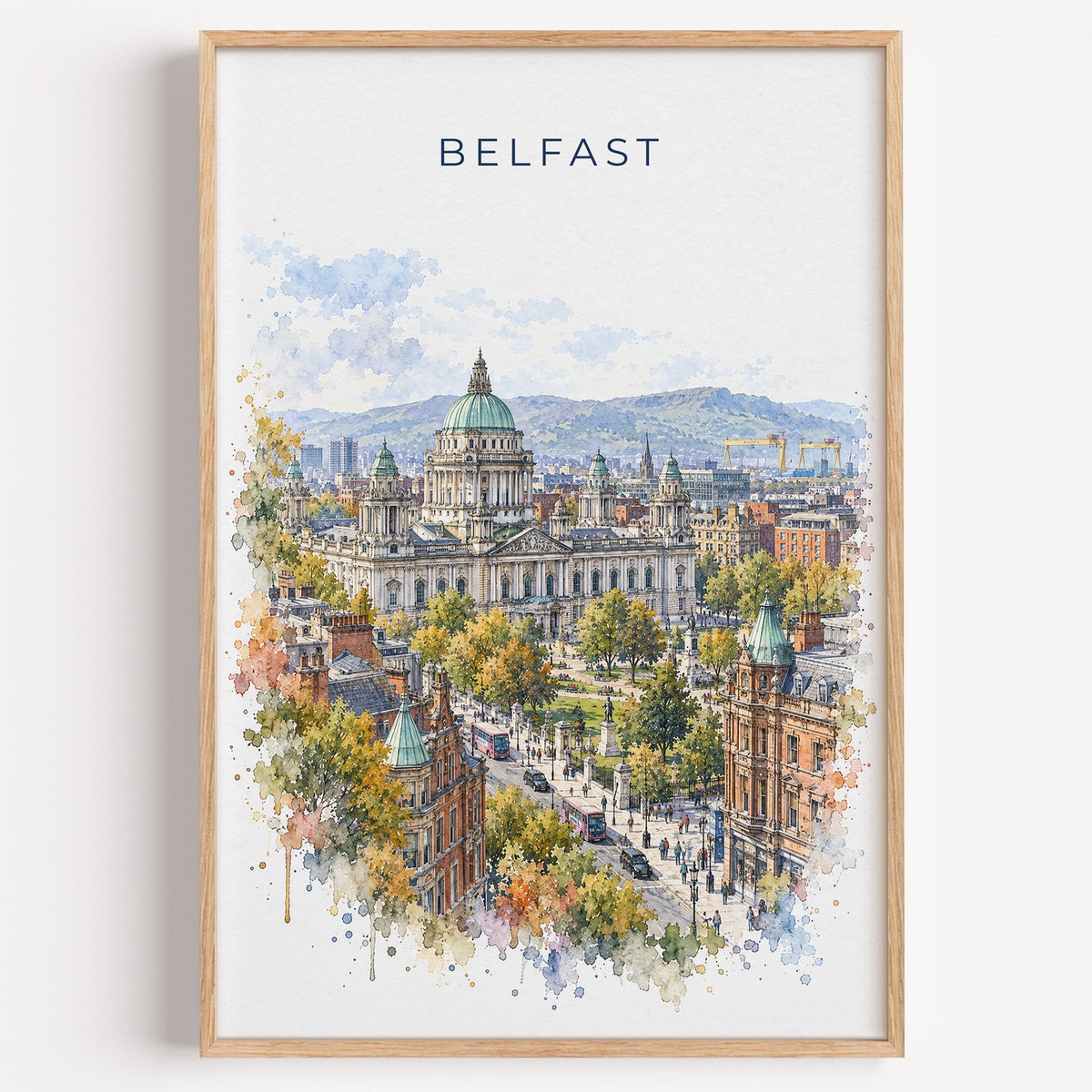 Belfast watercolor print in a light oak frame on a plain white wall