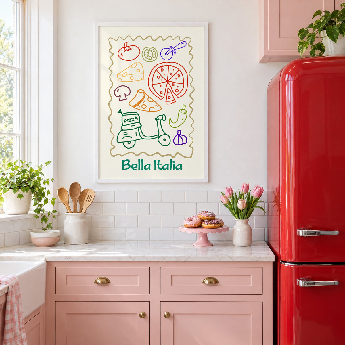 Bella Italia pizza scooter doodle print in a white frame above pink cabinets beside a red retro fridge
