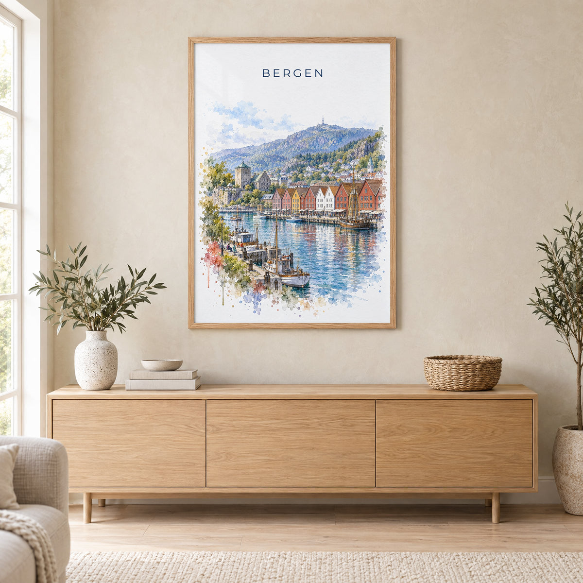 Bergen, Norway watercolor print in an oak frame above a light wood sideboard in a Scandinavian living room