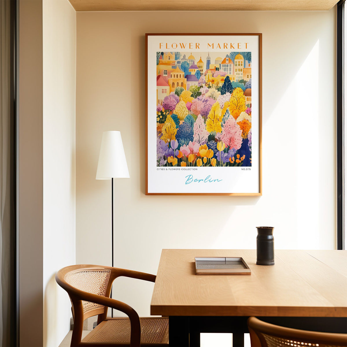 Berlin flower market print in an oak frame above a dining table and cane chair