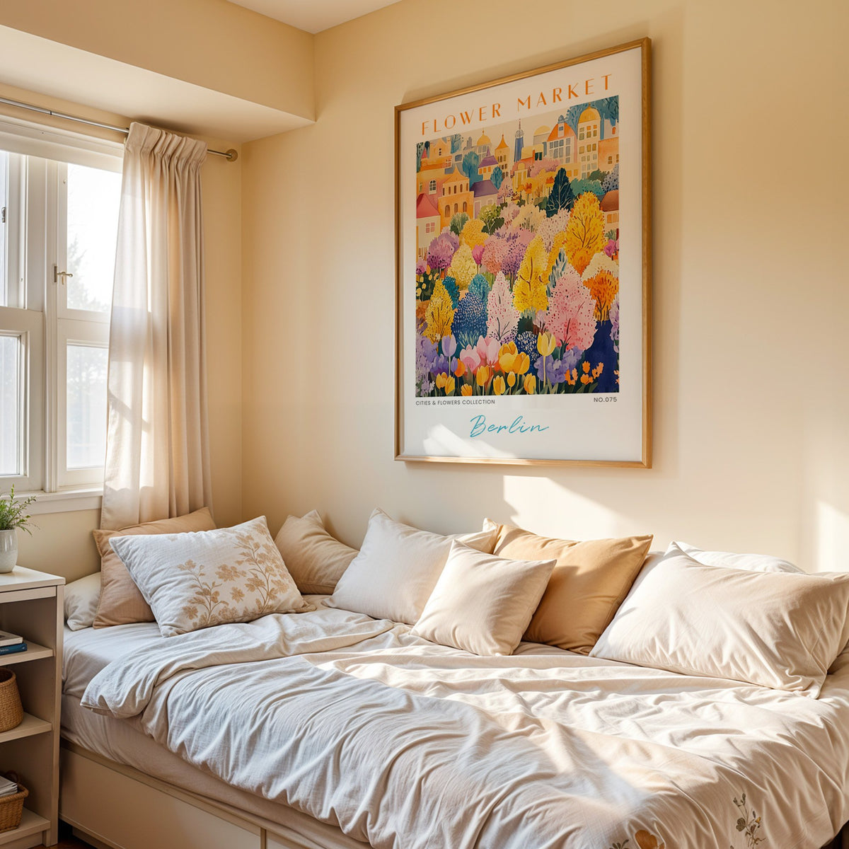 Berlin flower market print in an oak frame above a cream daybed in a sunny bedroom