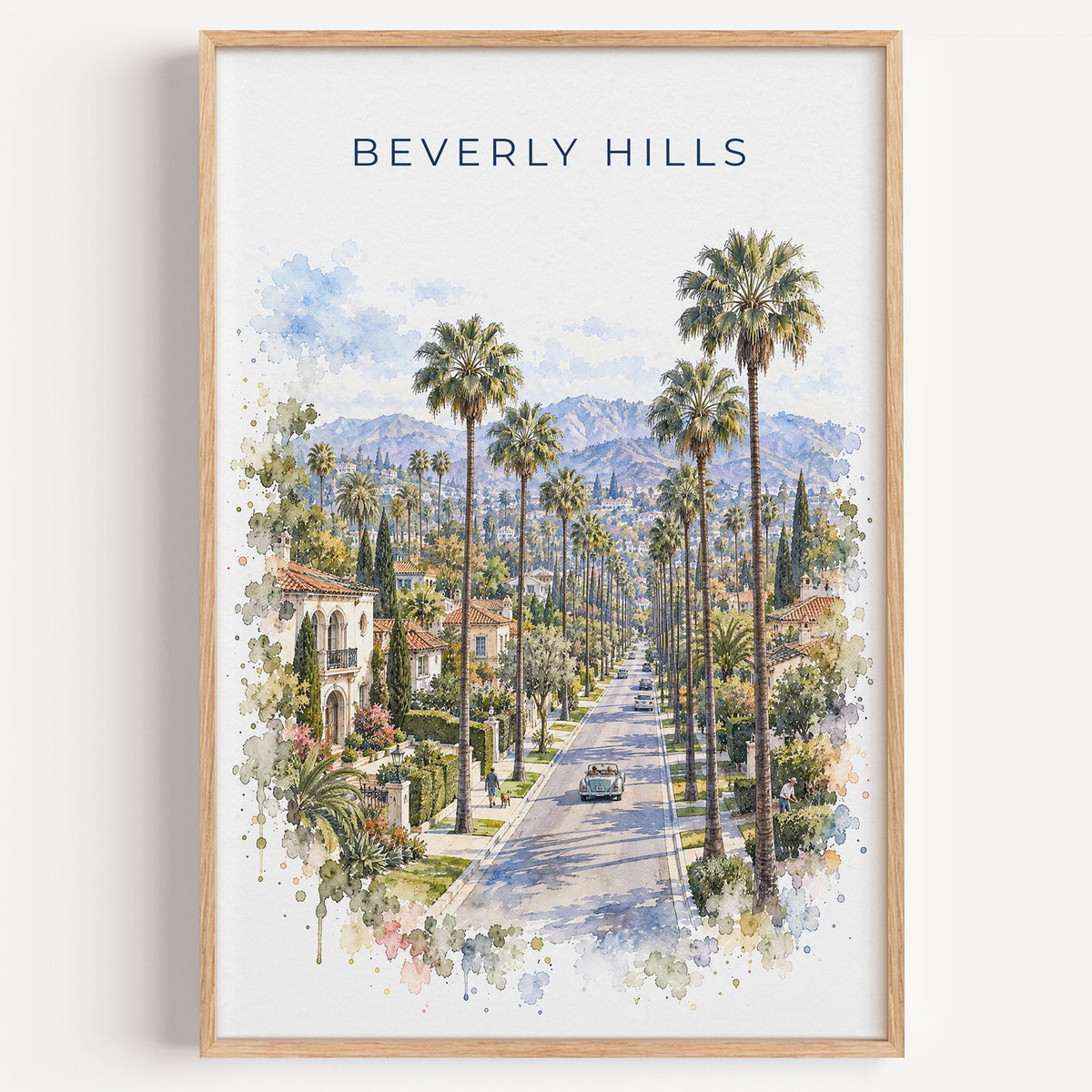 Beverly Hills watercolor print in a light oak frame on a plain white wall