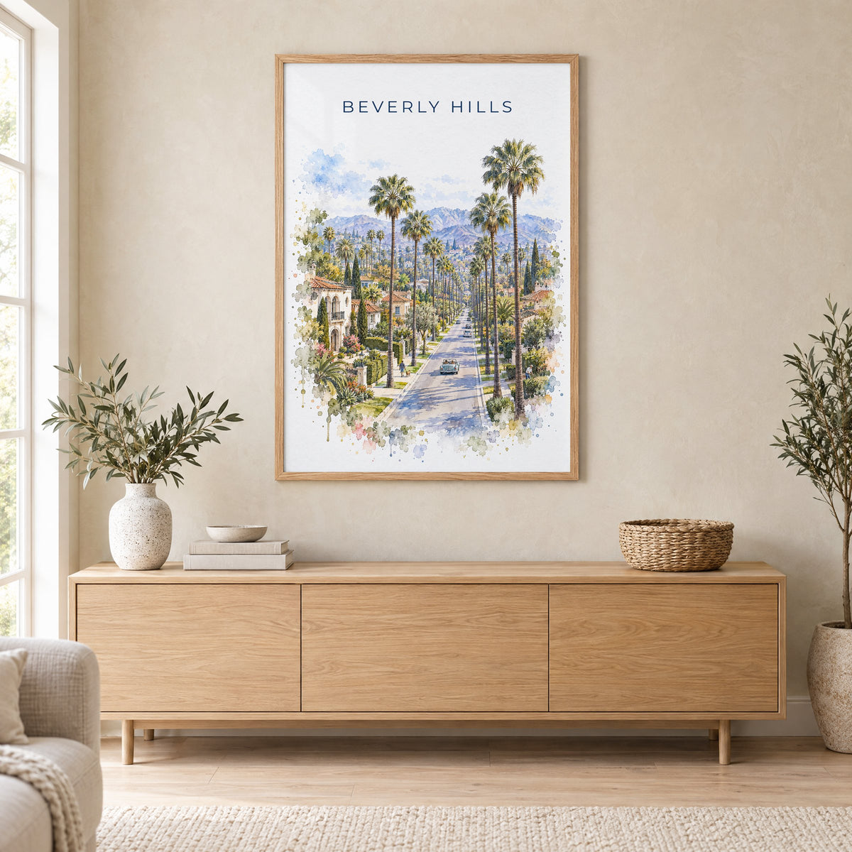 Beverly Hills watercolor print in an oak frame above a light wood sideboard in a Scandinavian living room