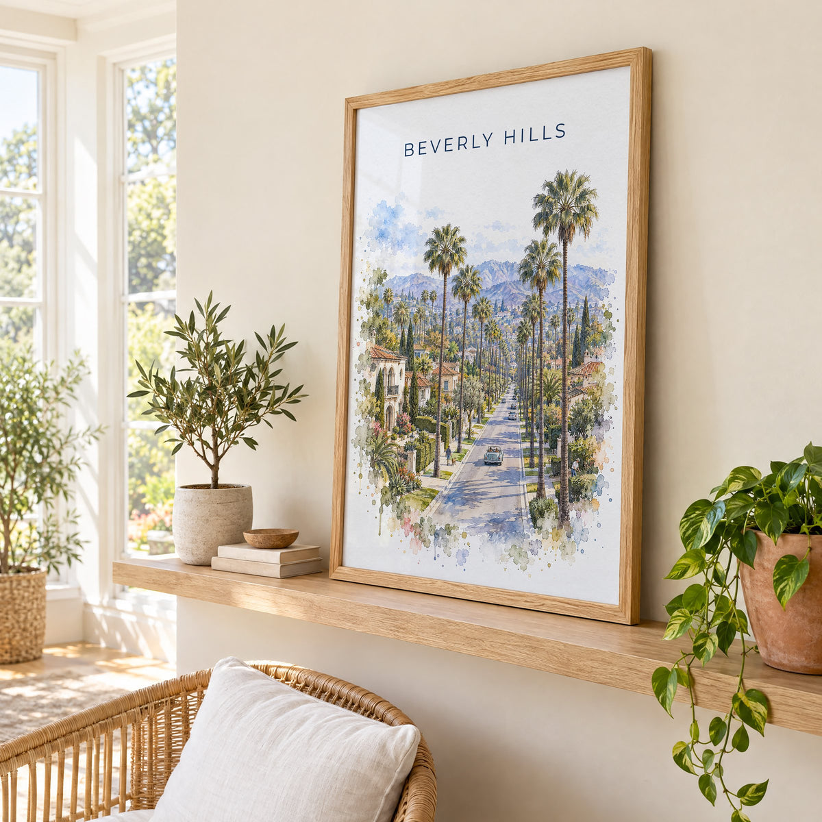 Beverly Hills watercolor print in an oak frame on a picture ledge in a sunlit sunroom