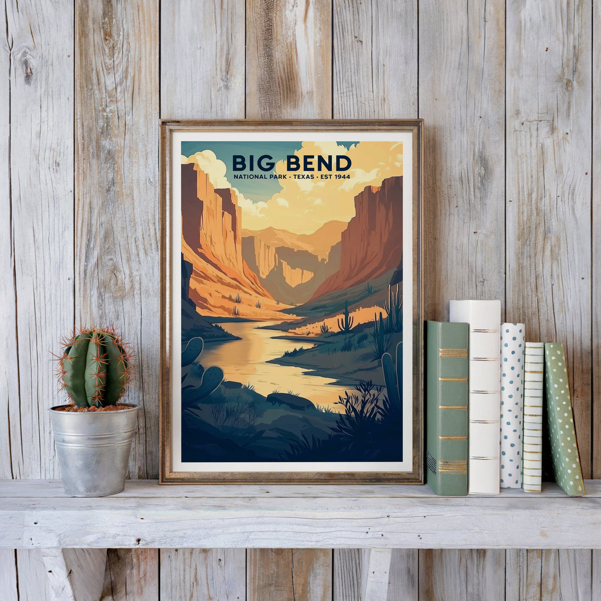 Big Bend poster in an antique gold frame against whitewashed farmhouse planks beside books