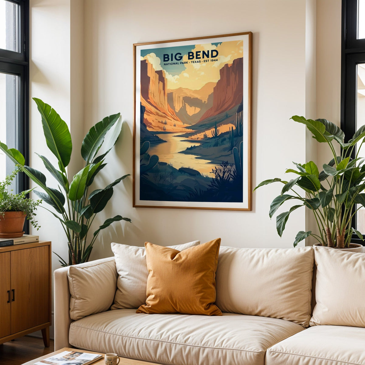 Big Bend National Park print in an oak frame above a cream living room sofa with an ochre cushion