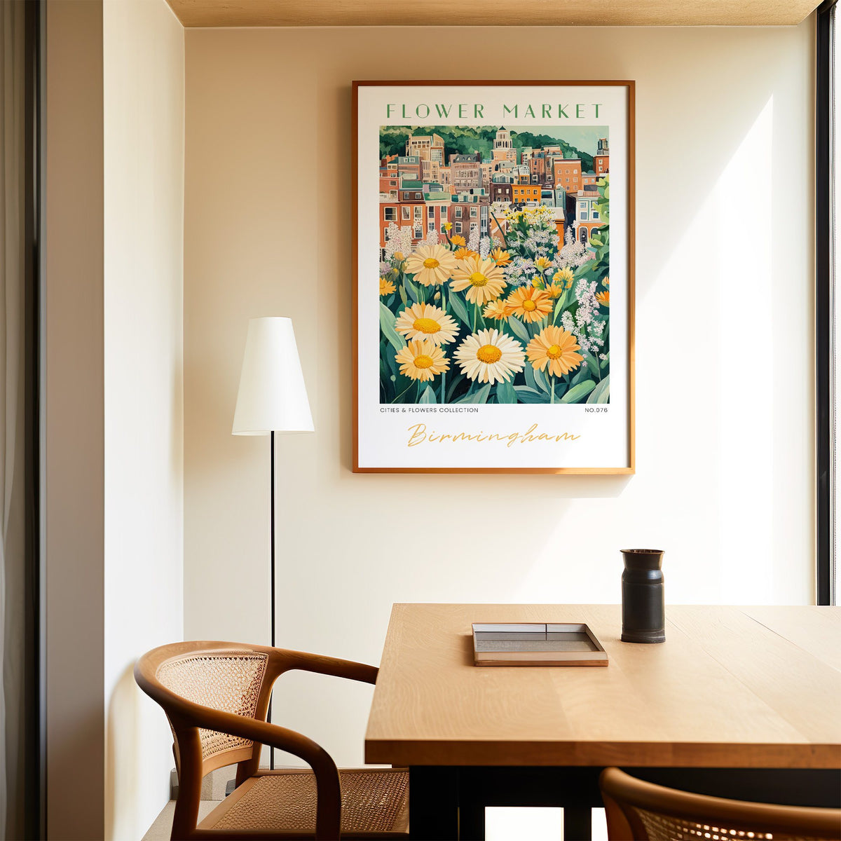 Birmingham flower market print in an oak frame above a dining table and cane chair