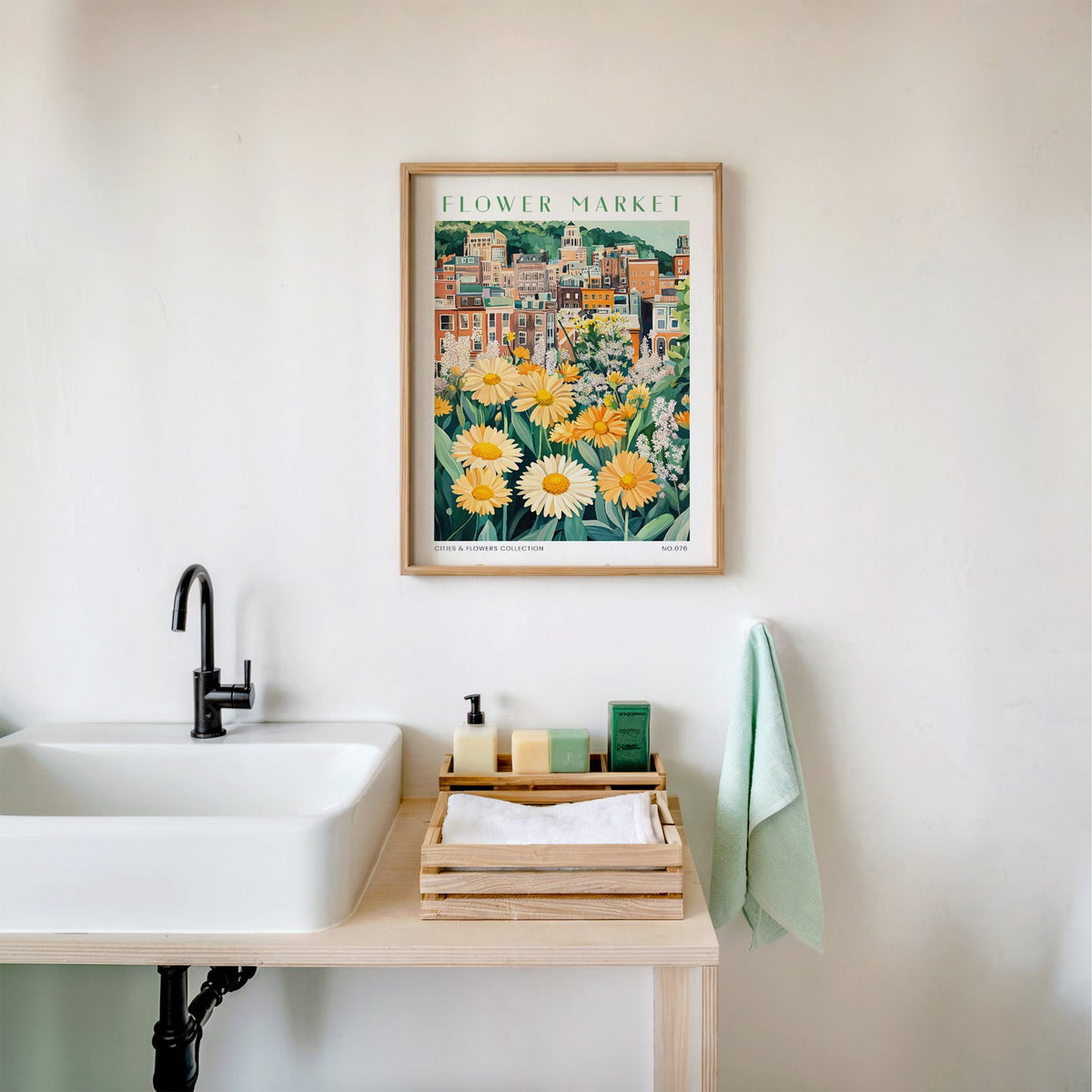 Birmingham flower market print in an oak frame above a white bathroom sink with folded towels