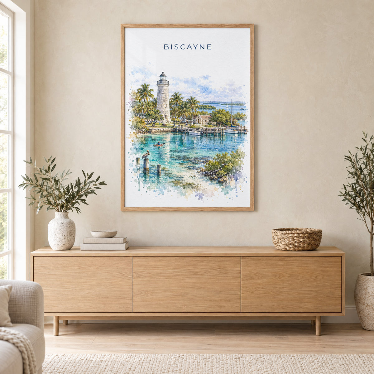 Biscayne National Park watercolor print in an oak frame above a light wood sideboard in a Scandinavian living room