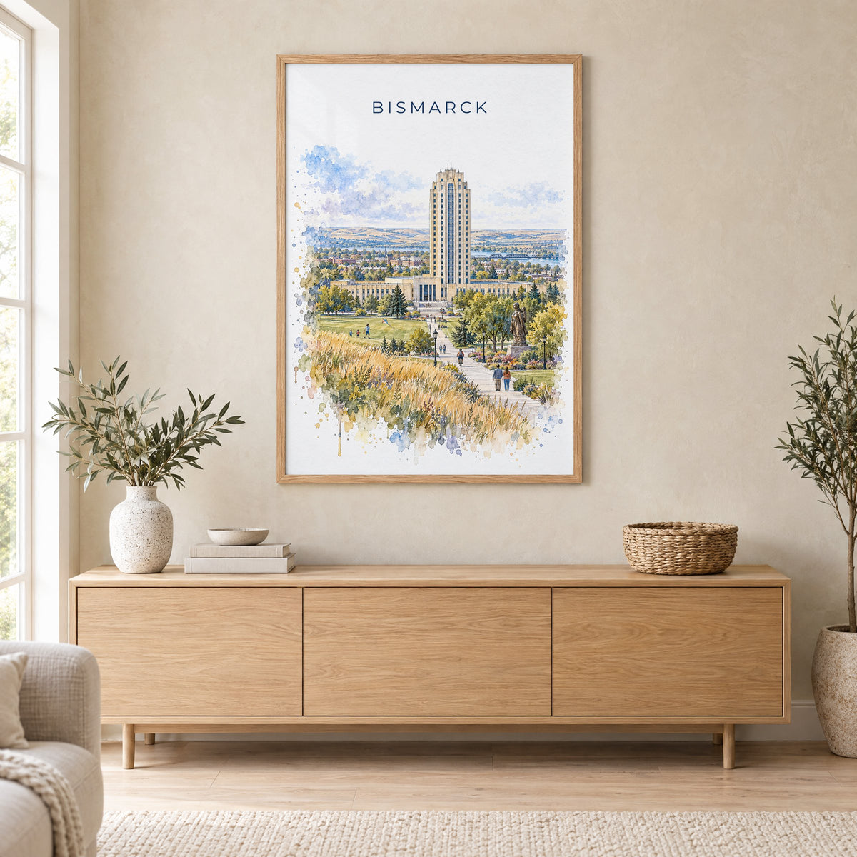 Bismarck watercolor print in an oak frame above a light wood sideboard in a Scandinavian living room