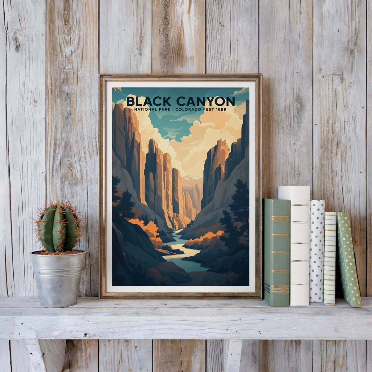 Black Canyon poster in an antique gold frame against whitewashed farmhouse planks and books