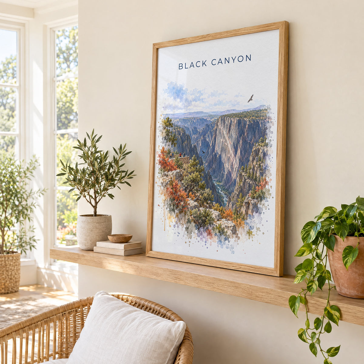 Black Canyon of the Gunnison National Park watercolor print in an oak frame on a picture ledge in a sunlit sunroom