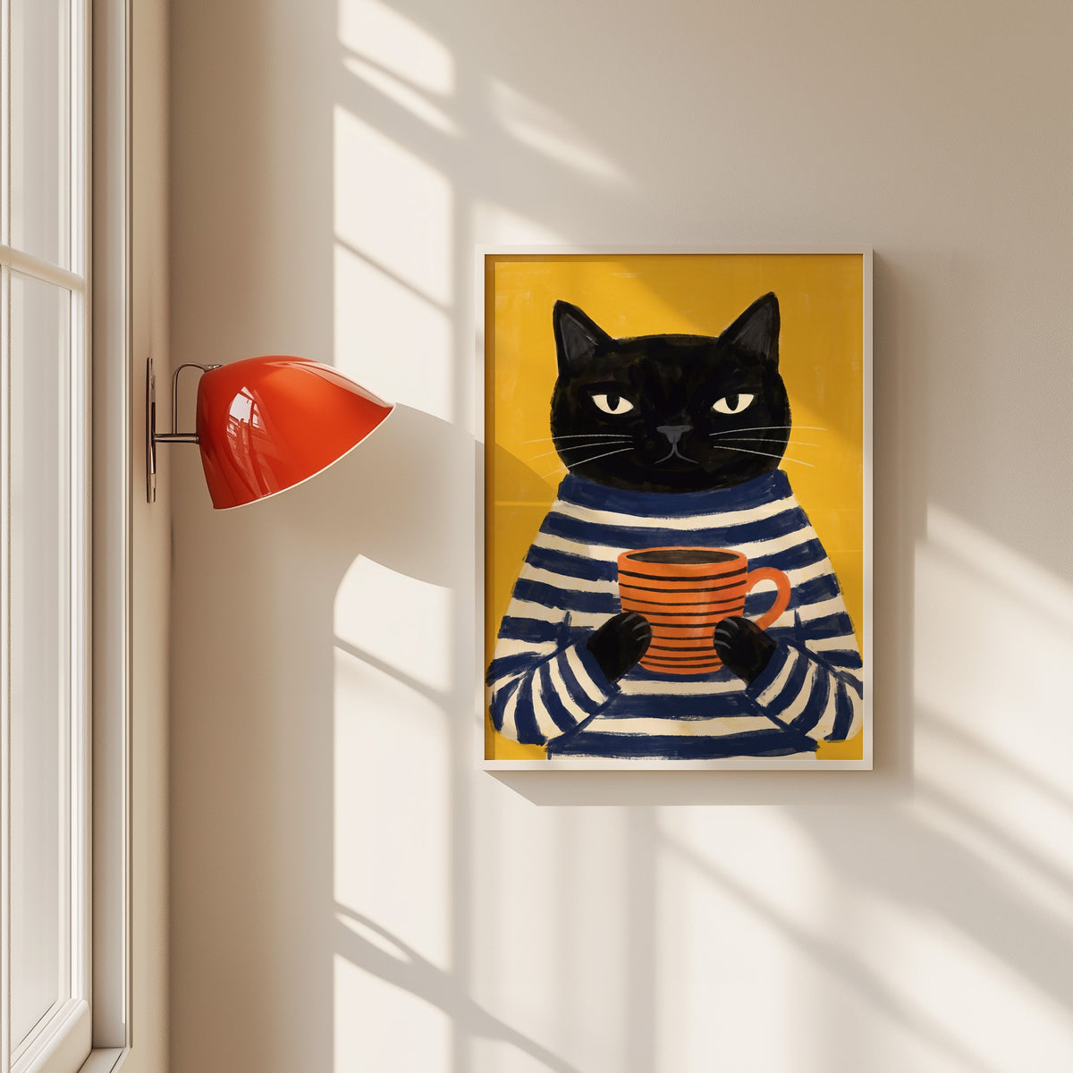 Black cat coffee mug print in a white frame beside a red wall sconce