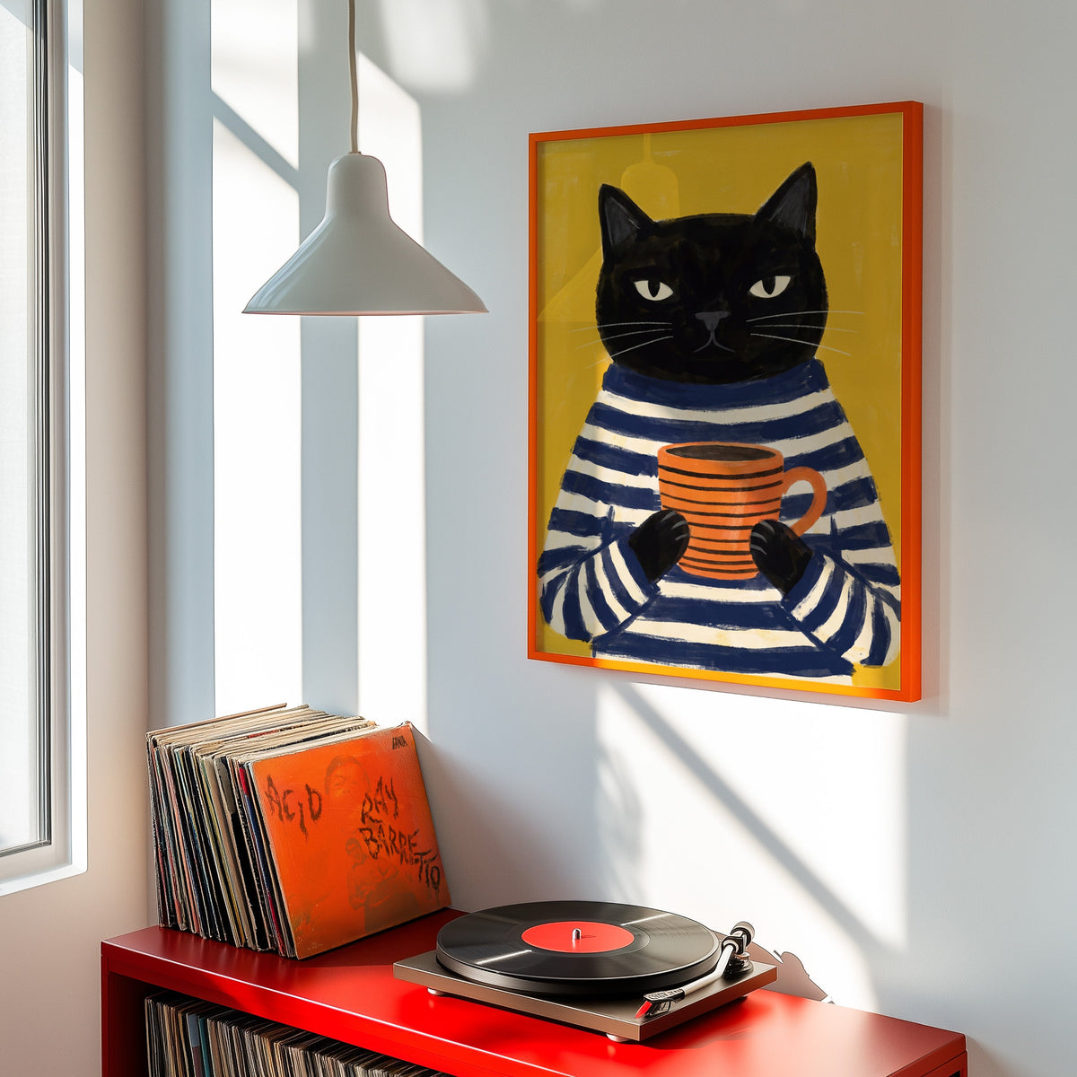 Grumpy cat with coffee print shown in an orange frame above a red record cabinet and turntable