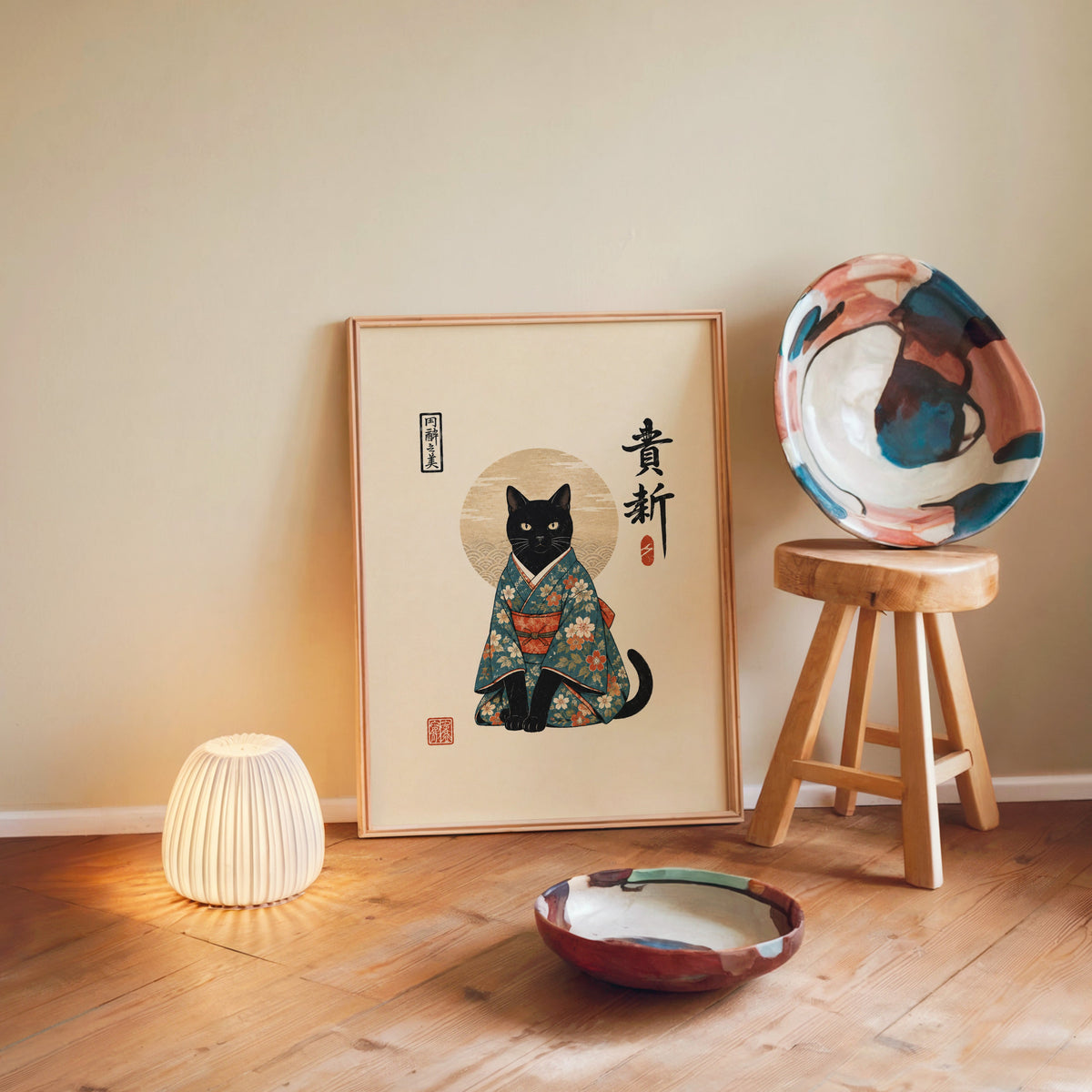 Black cat in floral kimono poster in a light wood frame leaning on a wooden floor by a glowing lamp and stool