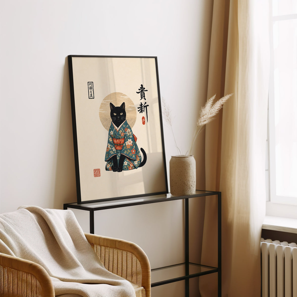 Black cat in floral kimono poster in a black frame leaning on a glass console beside pampas grass
