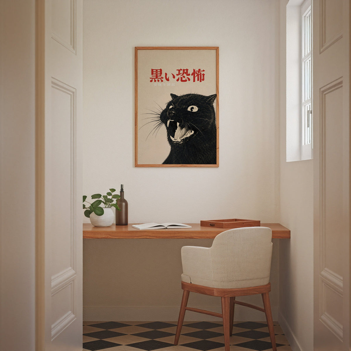 Hissing black cat kanji poster in an oak frame above a wall-mounted desk in a home office nook