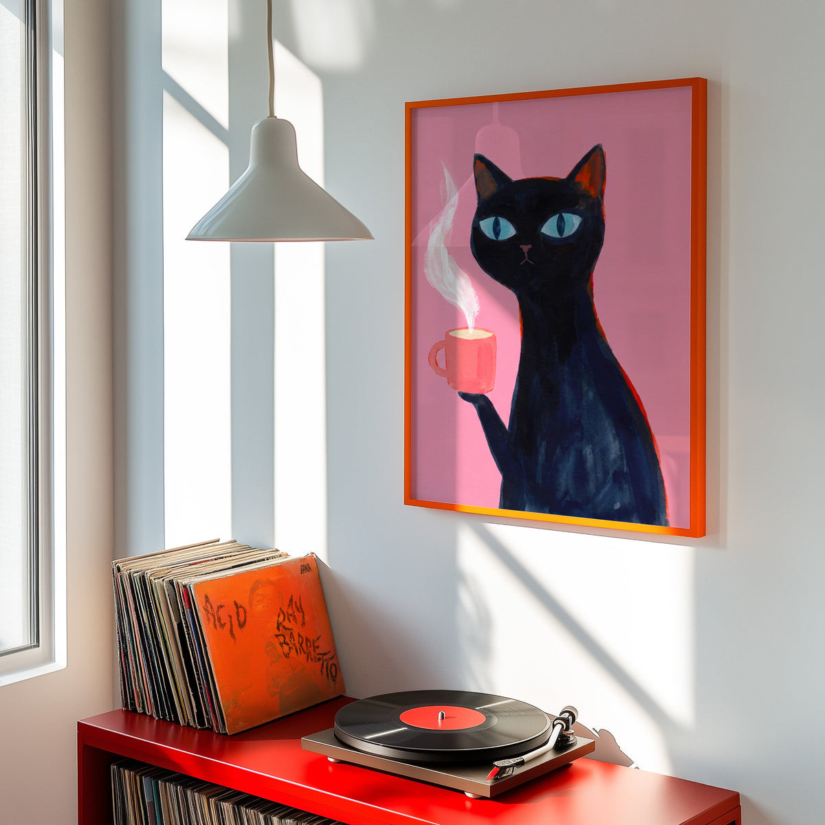 Pink cat coffee print shown in an orange frame above a red record cabinet and turntable