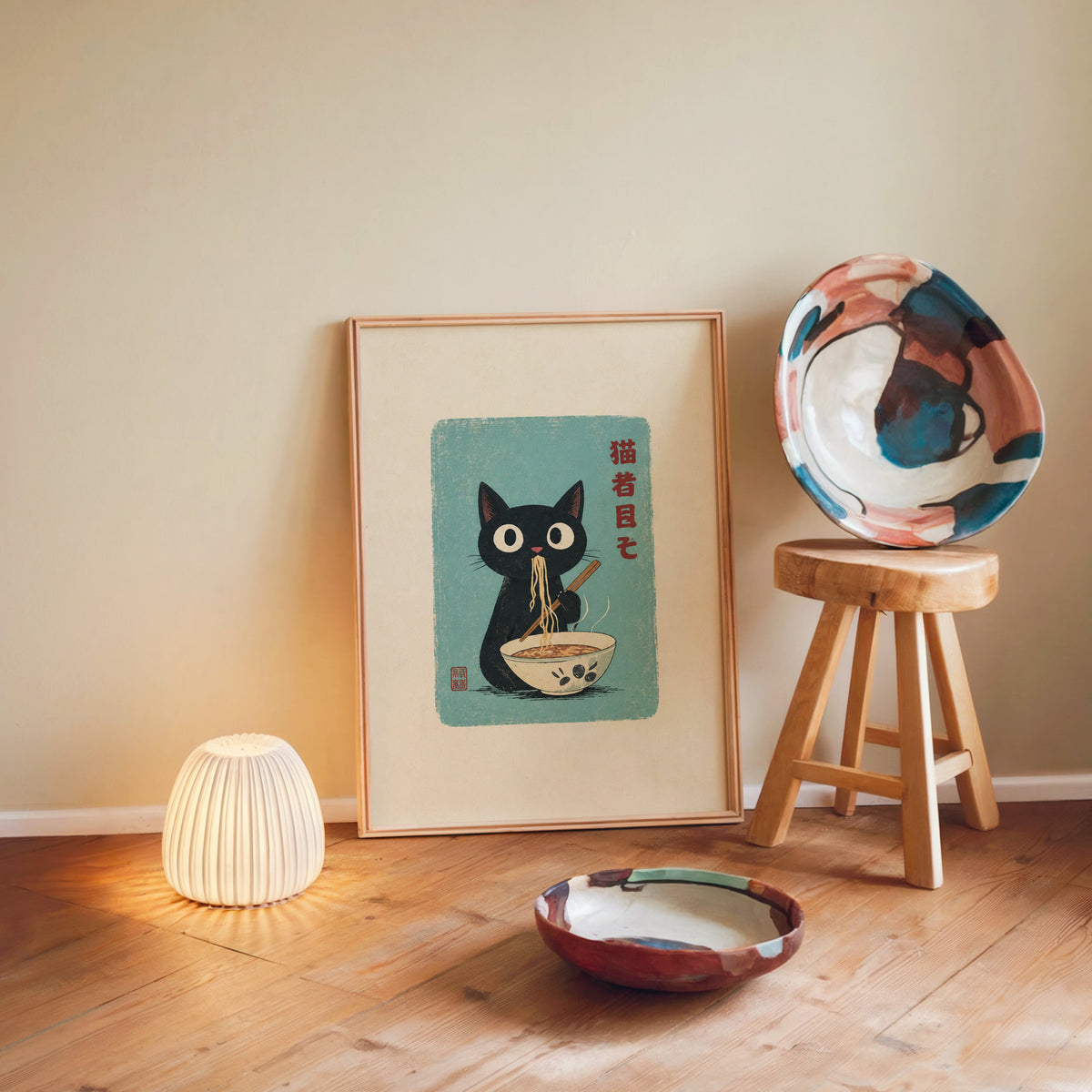 Black cat ramen teal poster in a light wood frame leaning on a wooden floor by a glowing lamp and stool