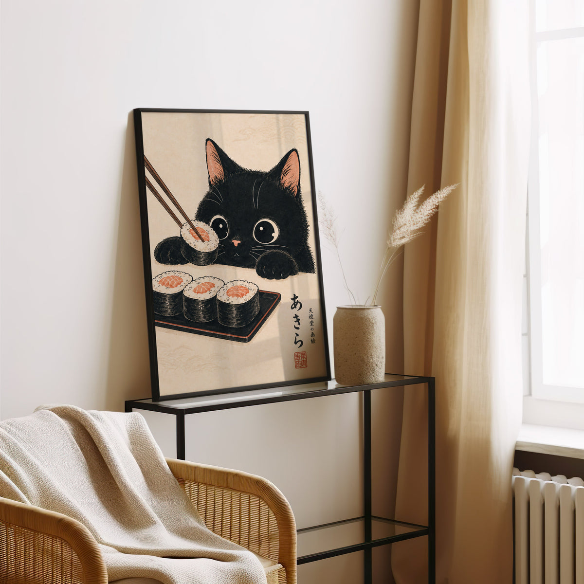 Black cat salmon sushi poster in a black frame leaning on a glass console beside pampas grass