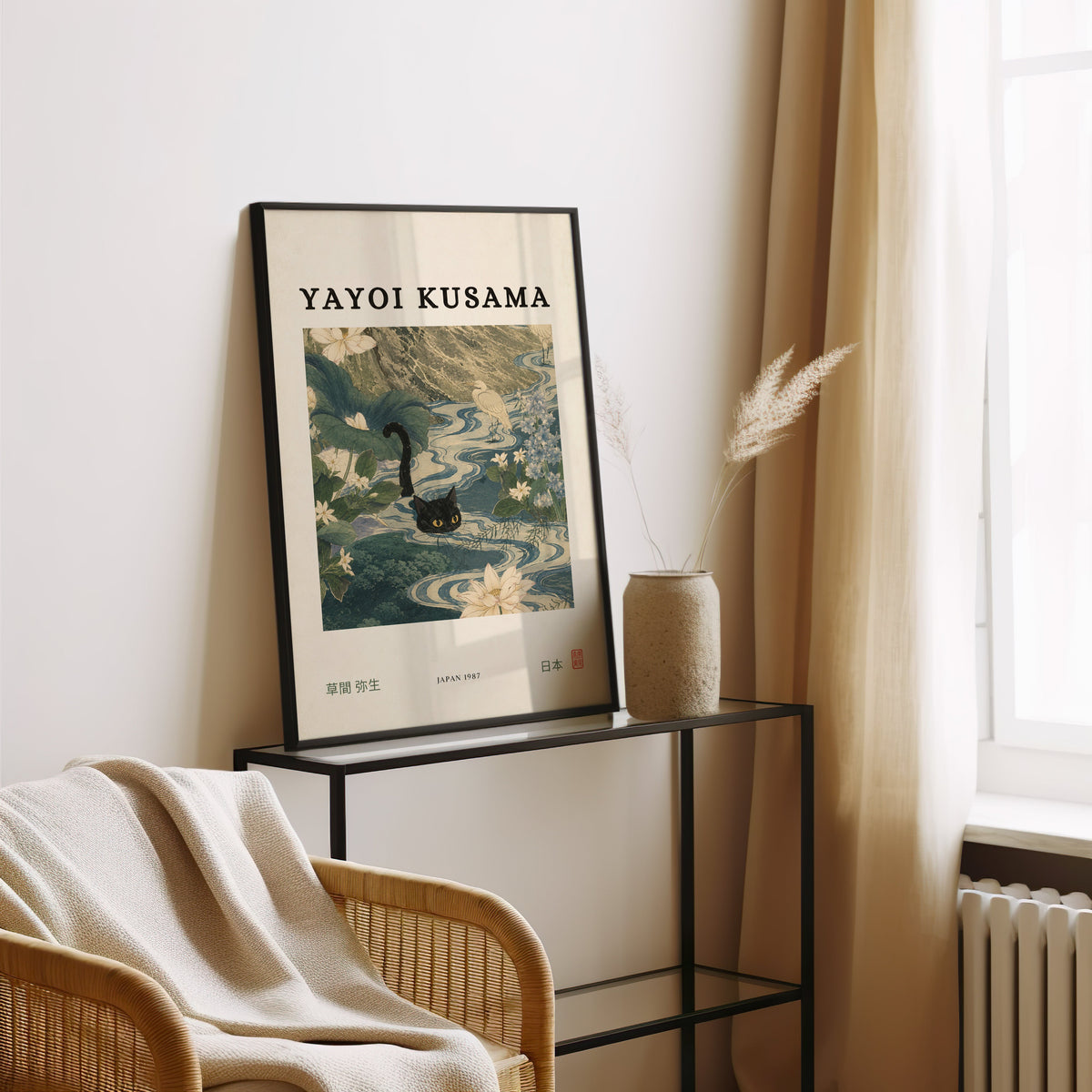 Black cat swimming lotus river poster in a black frame leaning on a glass console beside pampas grass