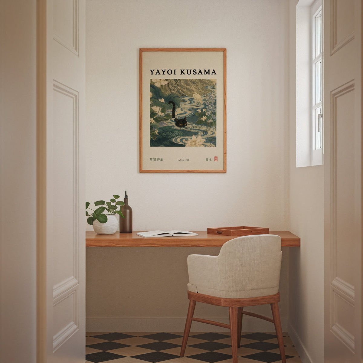 Black cat swimming lotus river poster in an oak frame above a wall-mounted desk in a home office nook