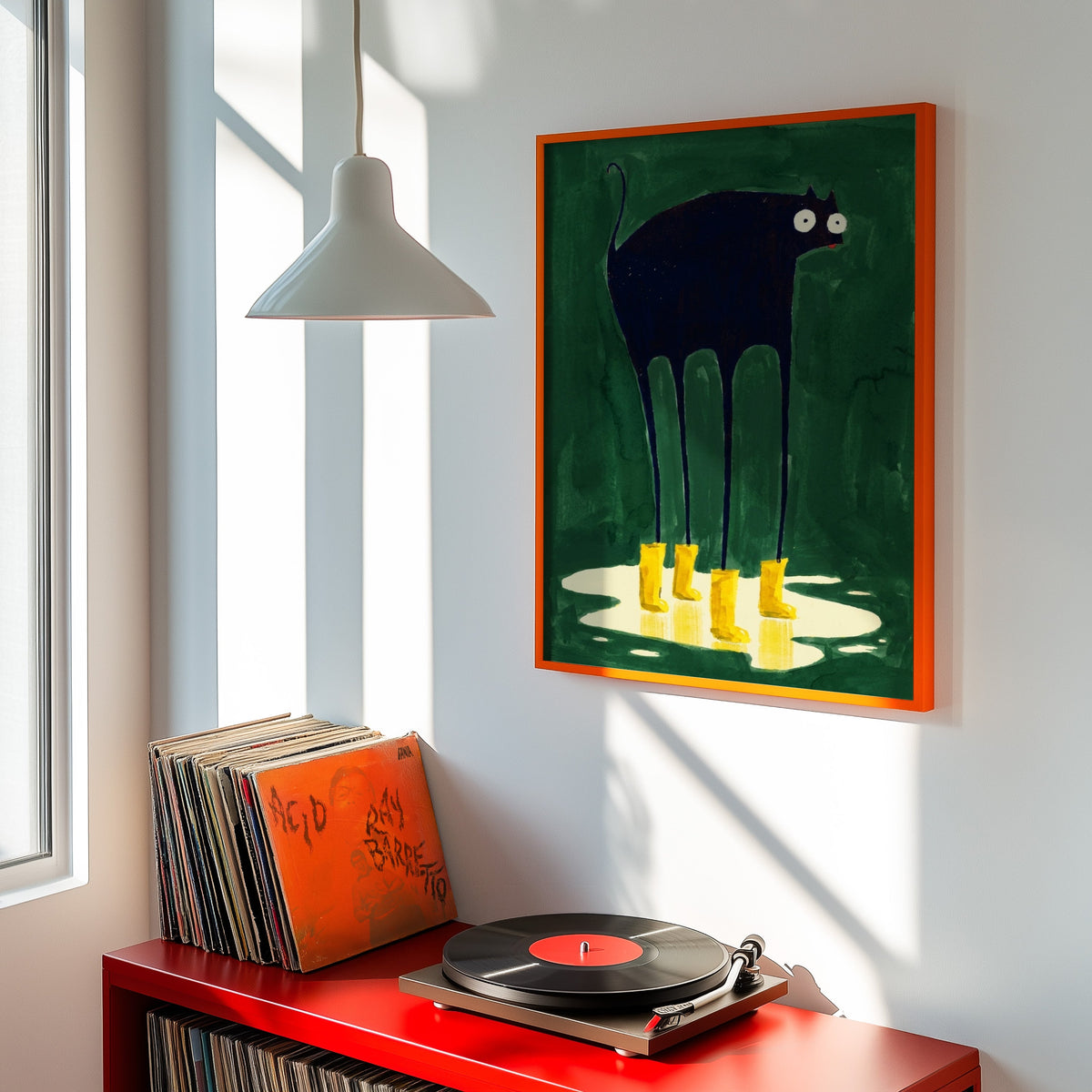 Green rainy day cat print shown in an orange frame above a red record cabinet and turntable