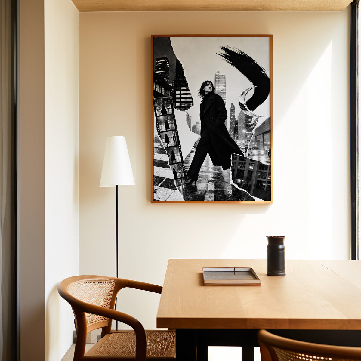 Woman in black coat torn paper collage print in an oak frame above a dining table and cane chair