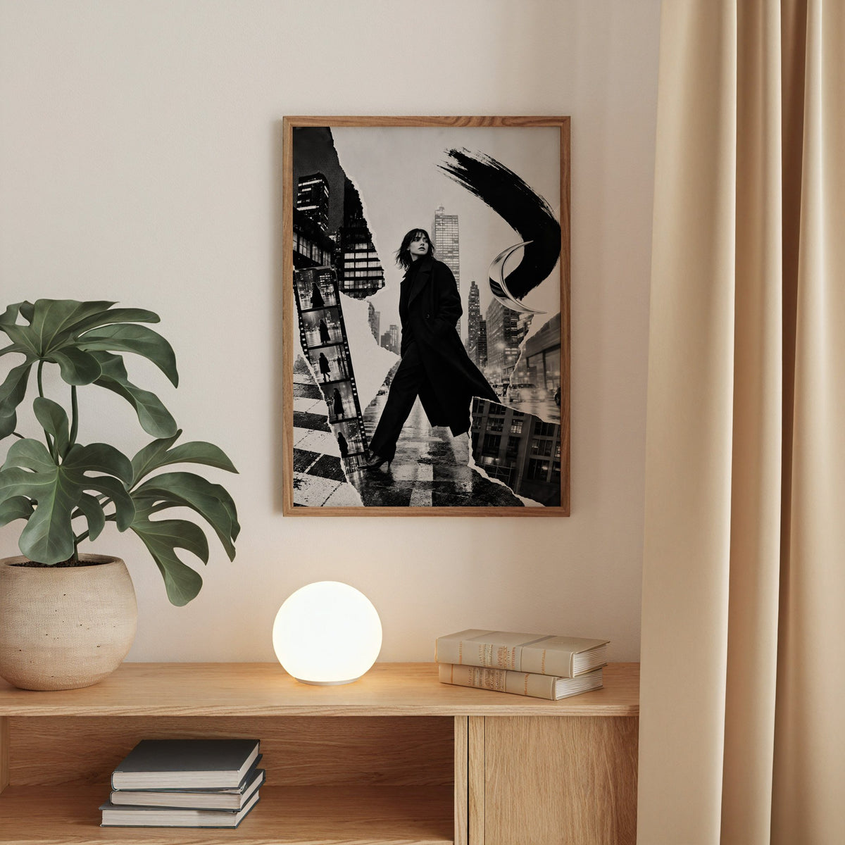 Woman in black coat torn paper collage print in a walnut frame above an oak cabinet with a glowing globe lamp