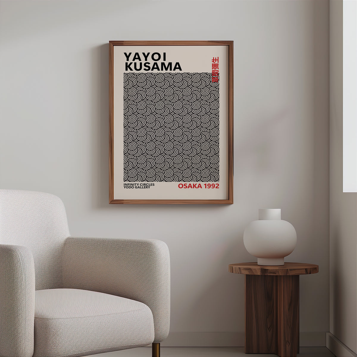 Yayoi Kusama inspired black concentric circles print in a wood frame above a cream boucle armchair