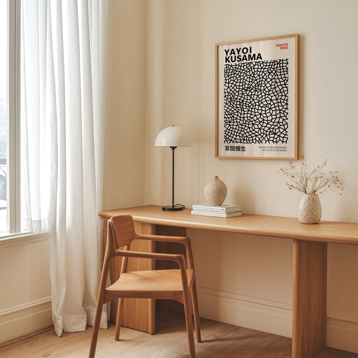 Yayoi Kusama inspired black net pattern print above a desk with a dome lamp