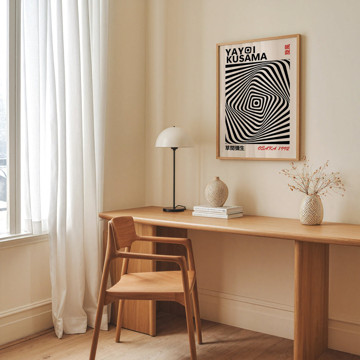 Yayoi Kusama inspired black diamond warp op art print in an oak frame above an oak desk with a dome lamp