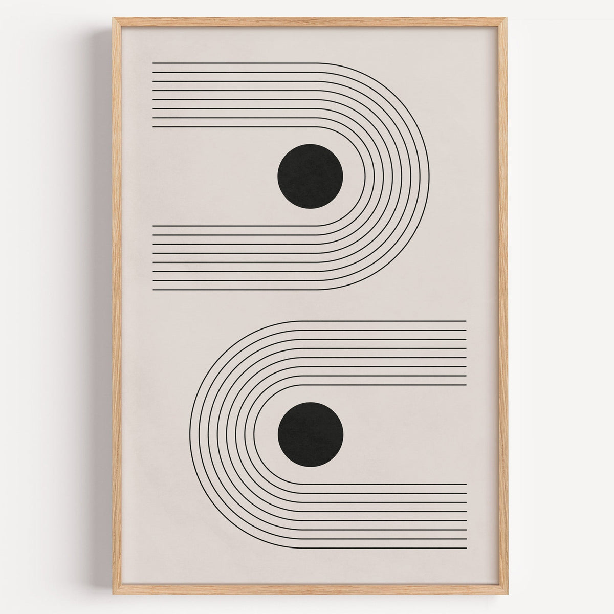 Black dots in sideways line arches print in a light oak frame on a plain white wall