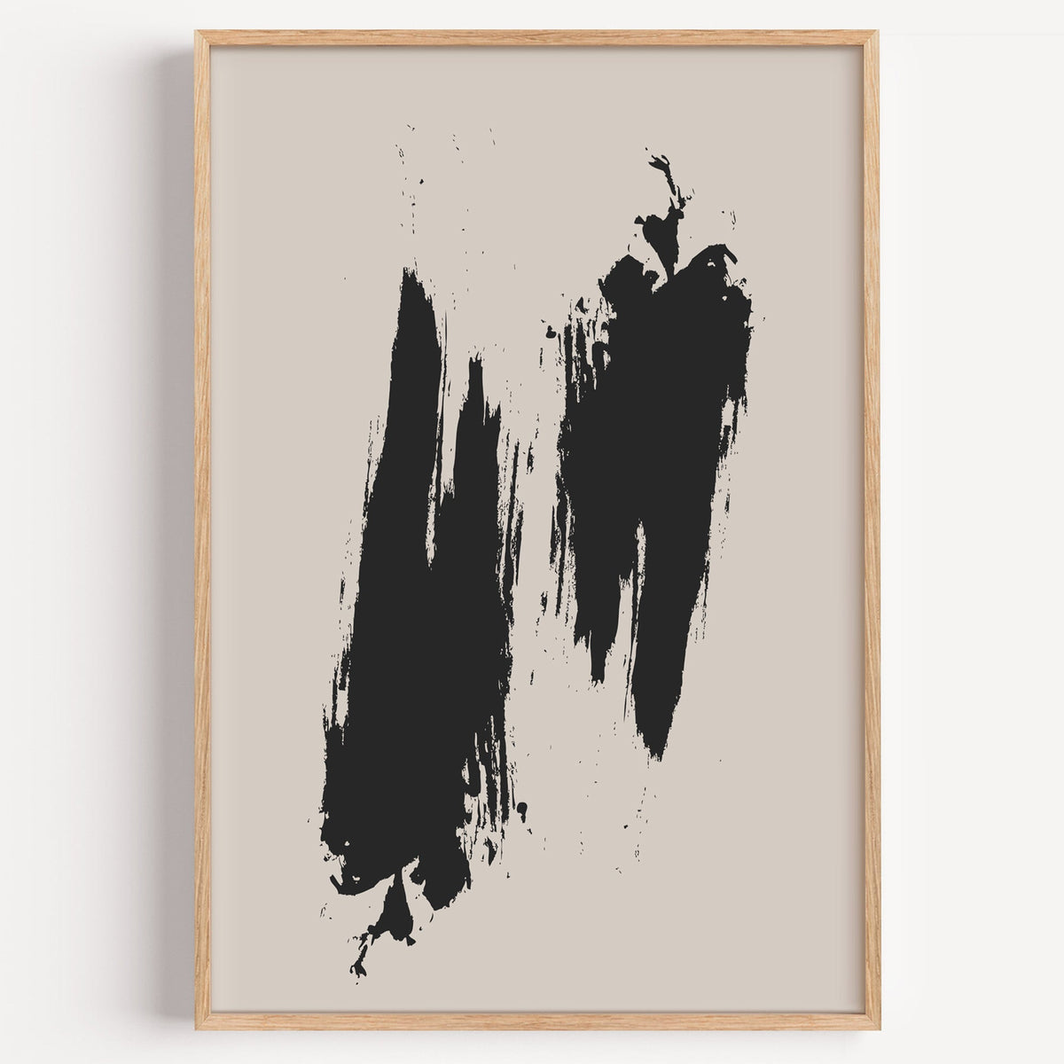 Black dry brush twin strokes minimalist print in a light oak frame on a plain white wall