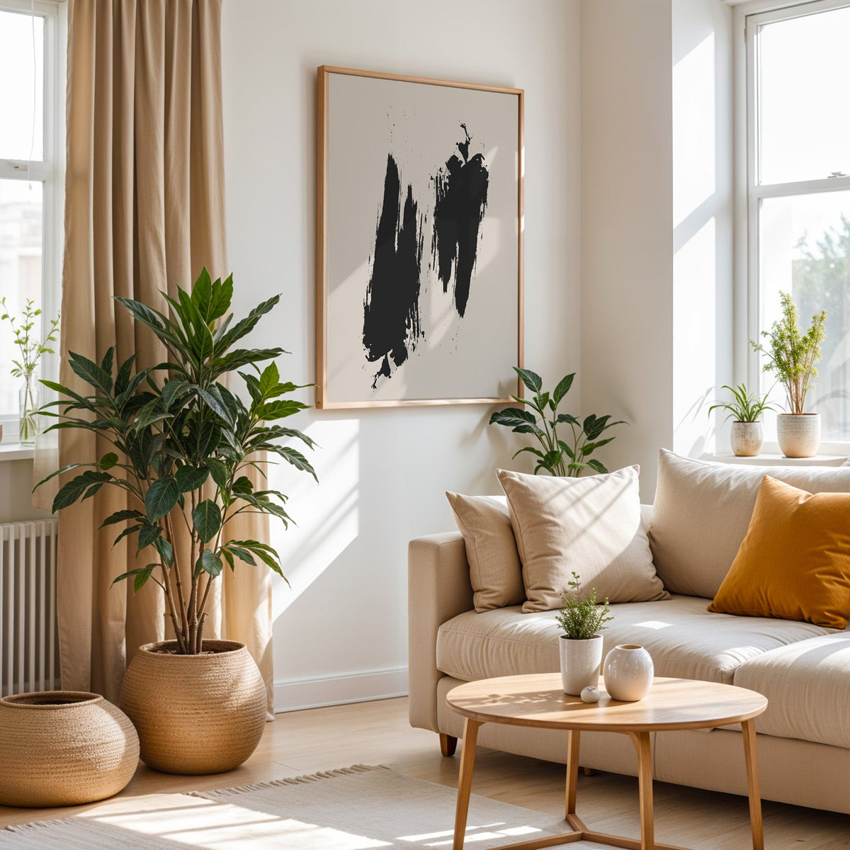Black dry brush twin strokes minimalist print in an oak frame above a cream sofa beside a tall plant in a woven pot