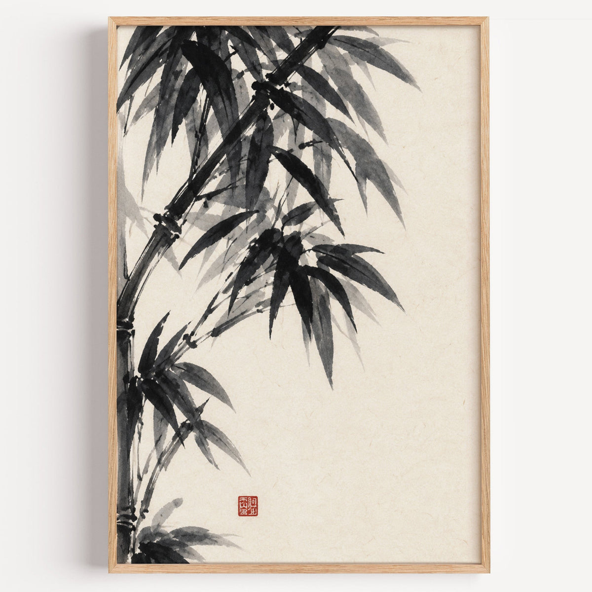 Black ink bamboo sumi-e poster in a light oak frame on a plain white wall