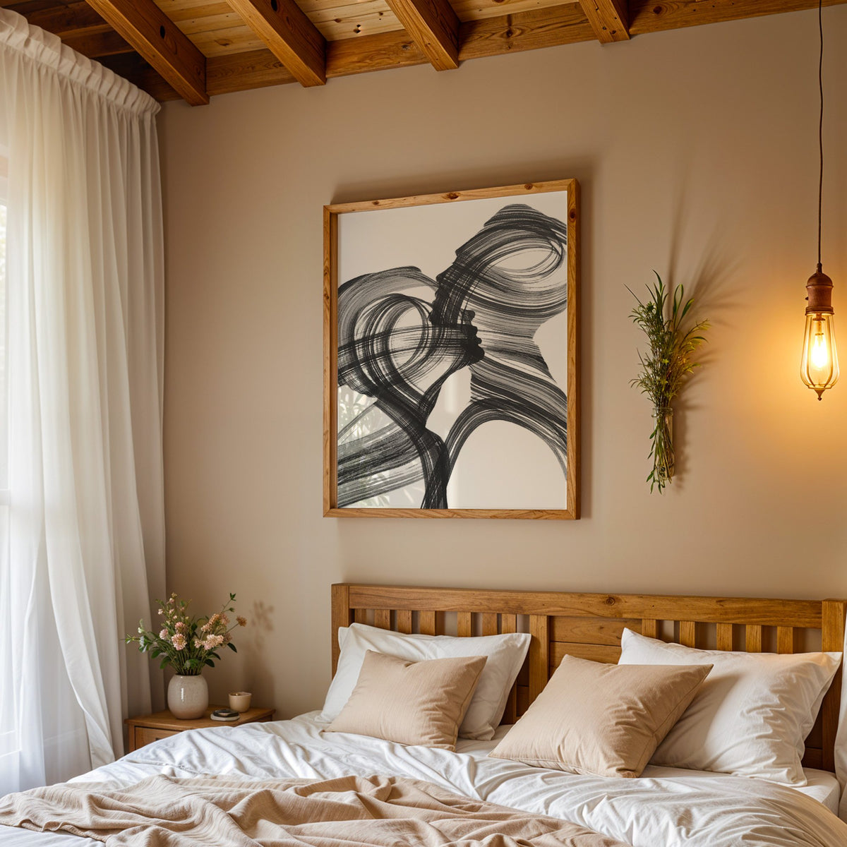 Black ink brush swirl abstract print in a pine frame above a wood headboard bed under a pendant bulb