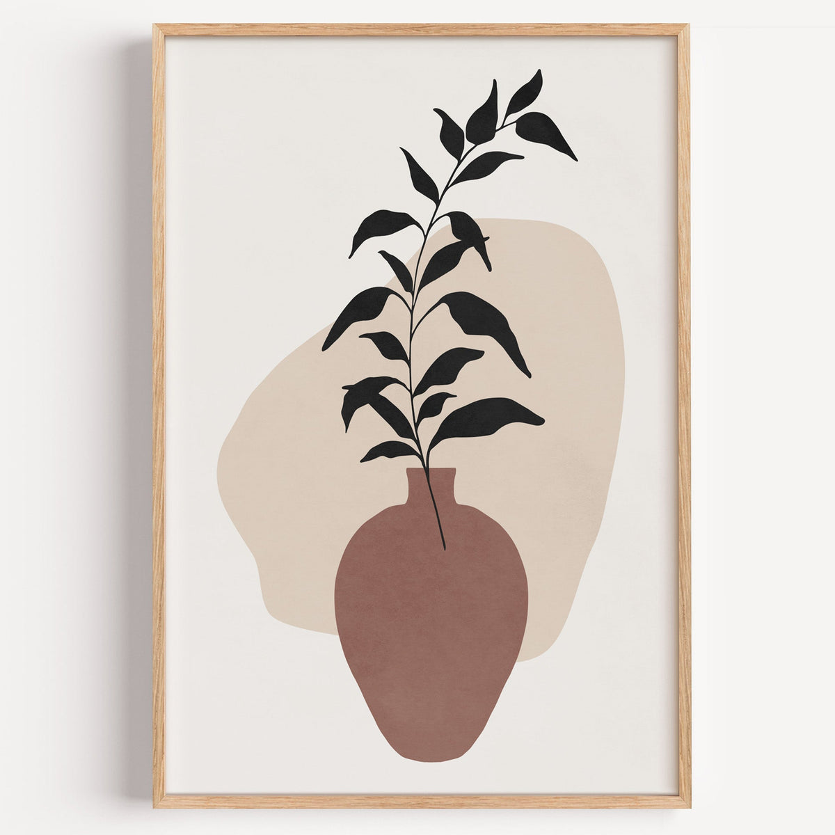 Black leaves in rosewood vase boho print in a light oak frame on a plain white wall