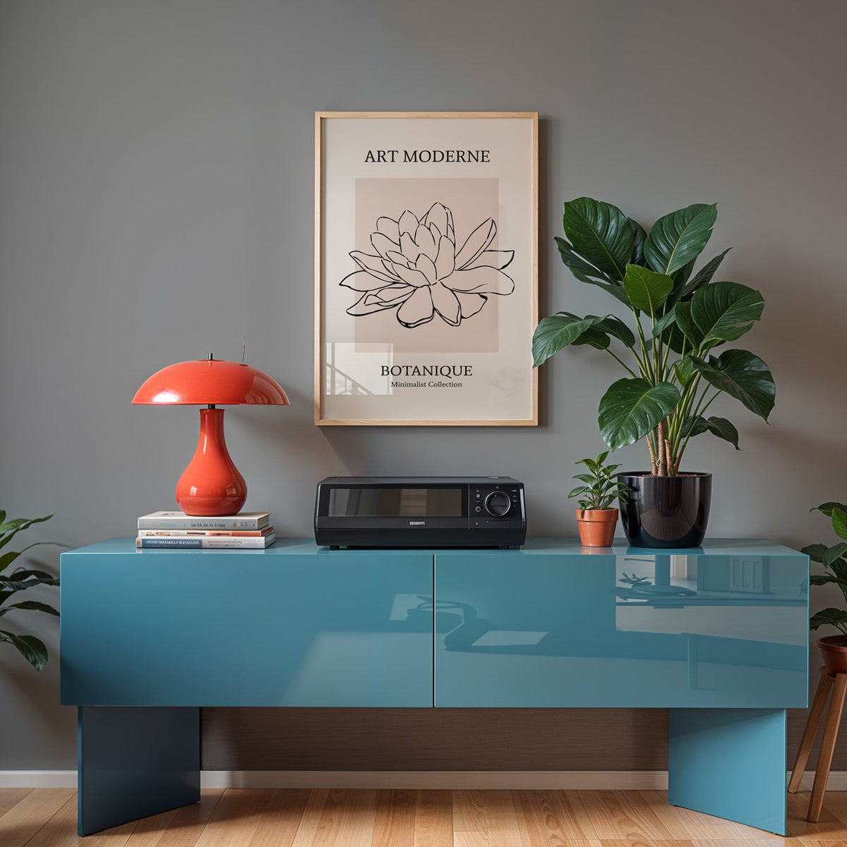 Black line flower on blush panel botanical print in a light oak frame above a teal sideboard with a red mushroom lamp