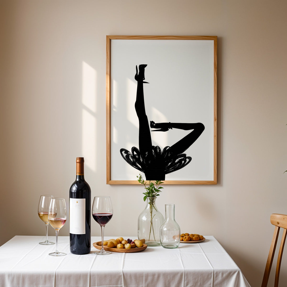 Black silhouette legs in heels with brushstroke skirt print in an oak frame above a table set with red wine and glasses