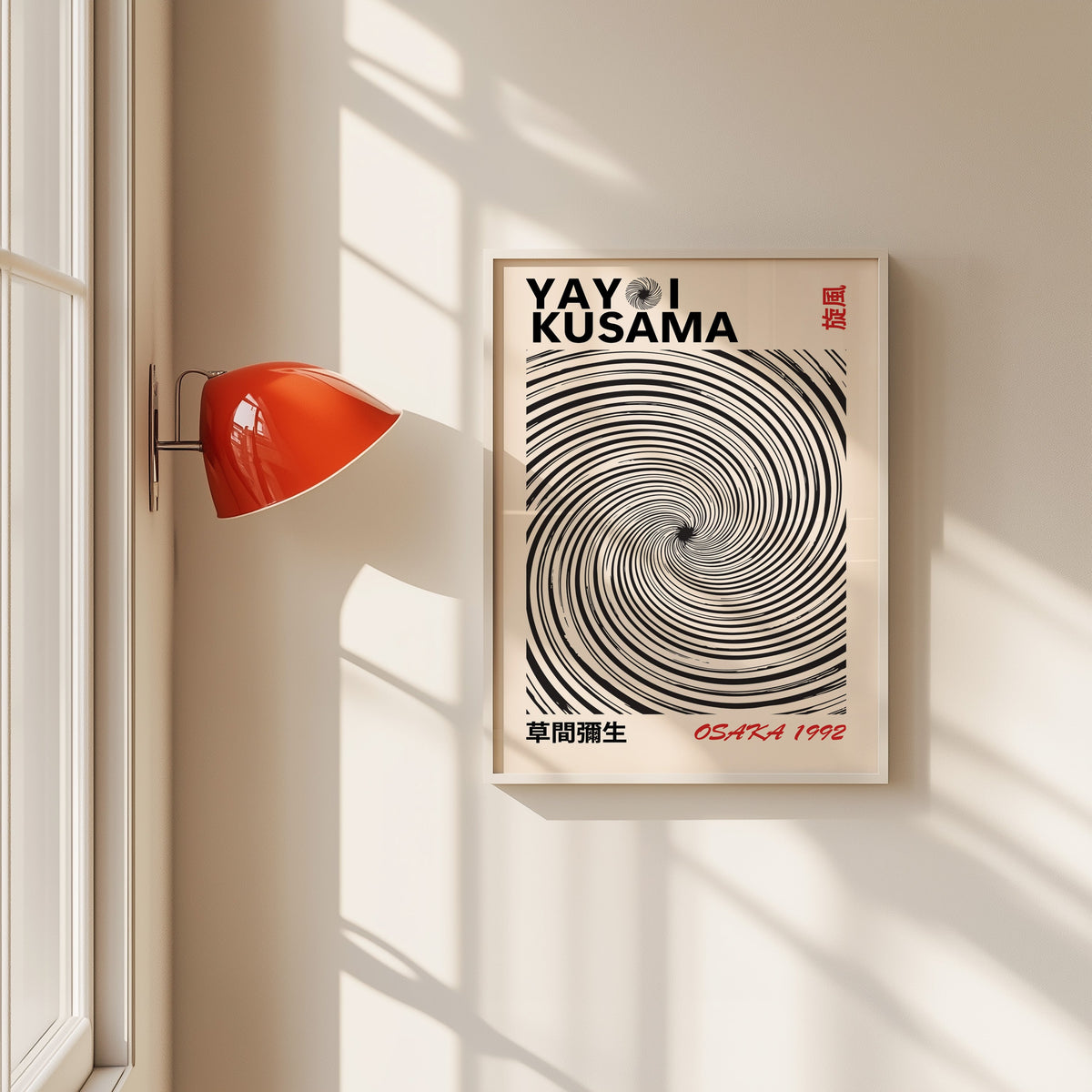 Yayoi Kusama inspired black spiral whirlwind print in a white frame beside a red wall sconce