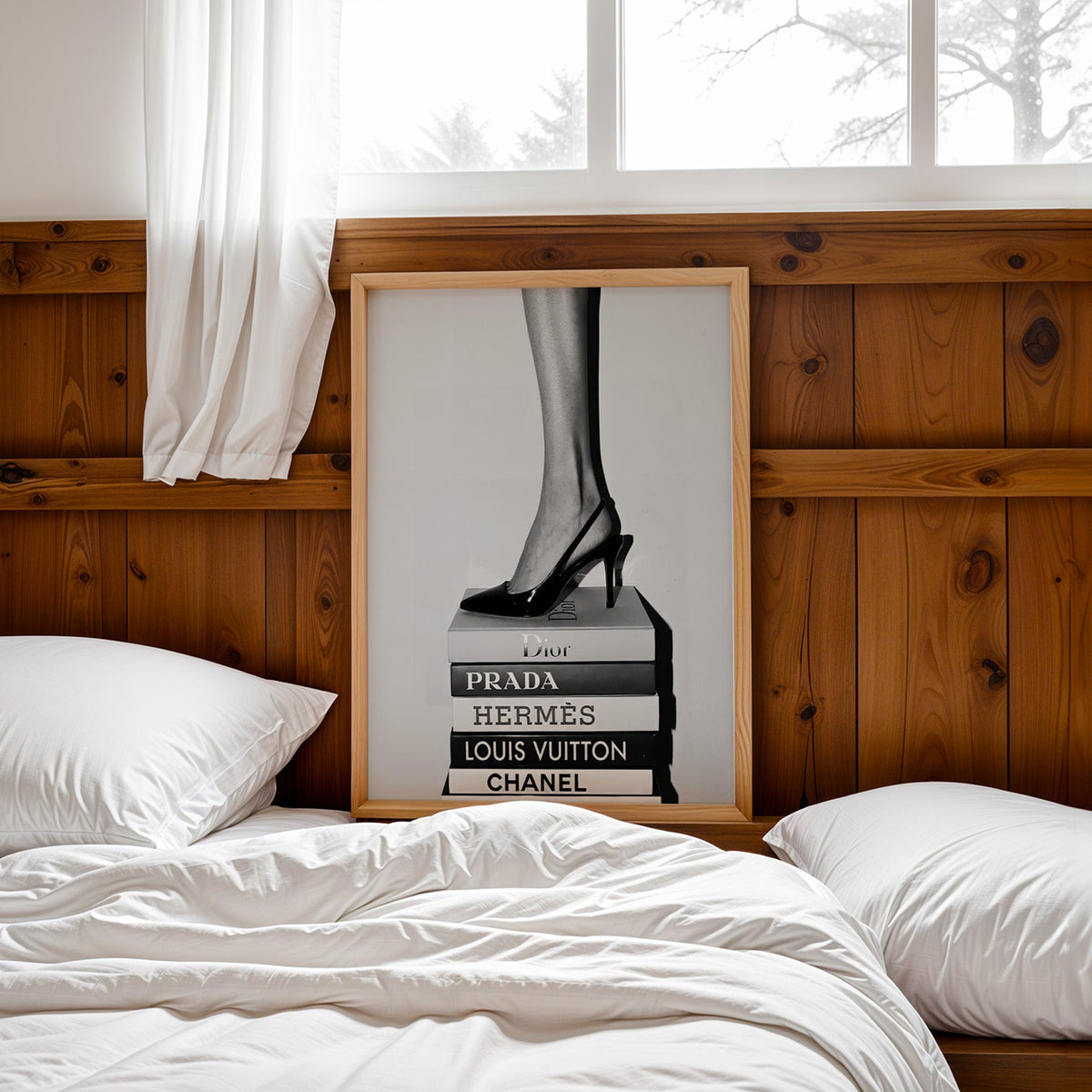 Glossy slingback heel standing on stacked books print in a pine frame leaning on a wood headboard over white bedding