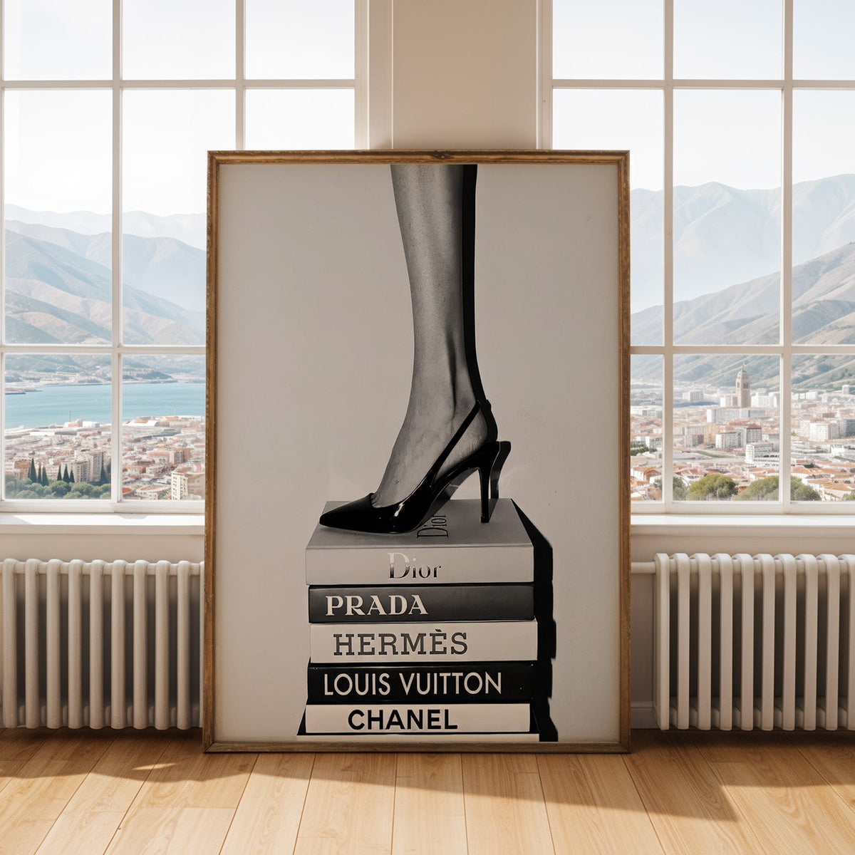 Glossy slingback heel standing on stacked books print shown in an antique gold frame by tall windows with a sea view
